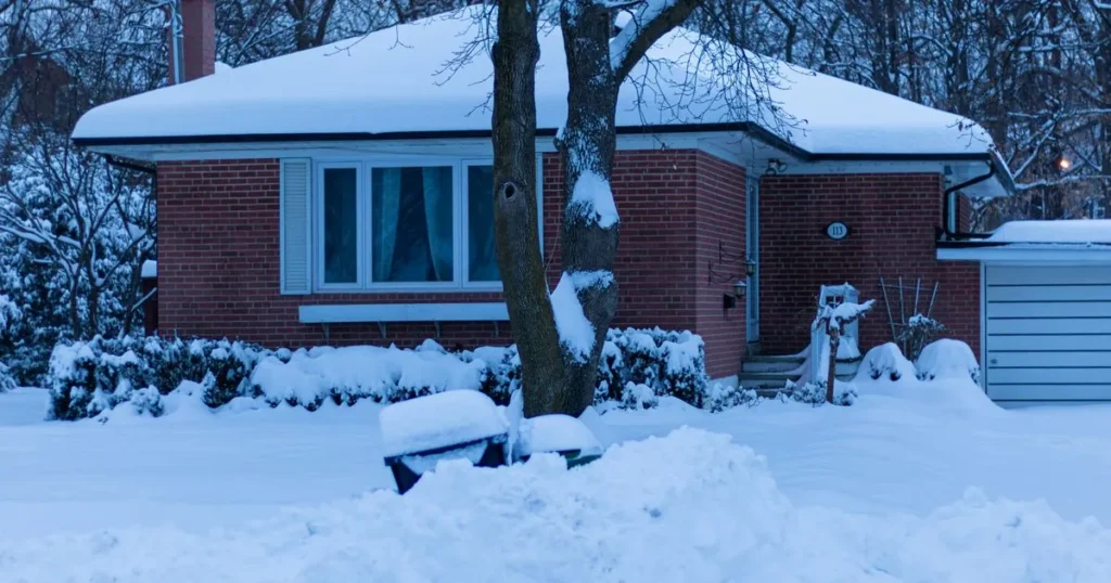 Snow covered brick bungalow in Toronto, the kind of Canadian home whose insurance cost has risen since 2023